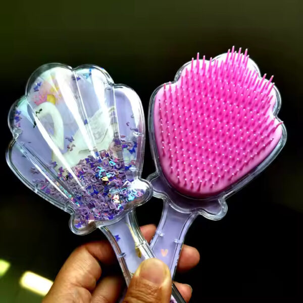 Shell shaped hair comb