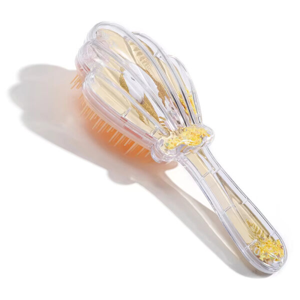 Shell shaped hair comb
