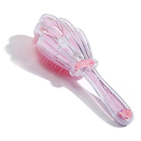 Shell shaped hair comb